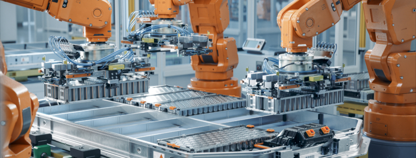 EV Battery Pack Automated Production Line Equipped with Orange Robot Arms. Modern Electric Car Smart Factory. Row of Advanced Robotic Arms inside Bright Plant Assemble Batteries for Automotive Industry